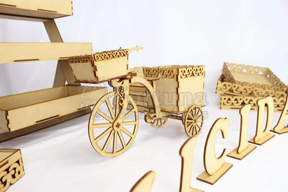 Bonito triciclo con sus partes móviles bonito para la mesa de dulces en tu boda.